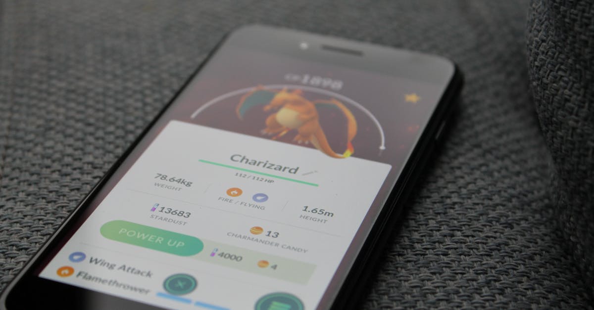 How can I know if a Pokemon has reached its final stage of evolution in Pokemon Go? - Turned-on Iphone Displaying Pokemon Go Charizard Application