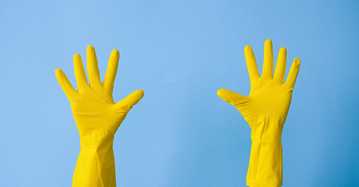 How can I make people stop freaking out when I drive? - Crop unrecognizable person in rubber gloves raising arms