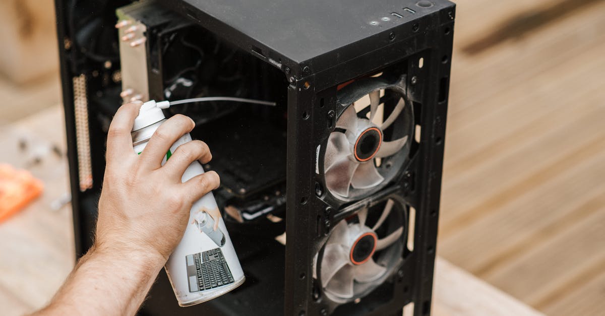 How can I remove the sudden death time? - Crop unrecognizable man cleaning computer system unit