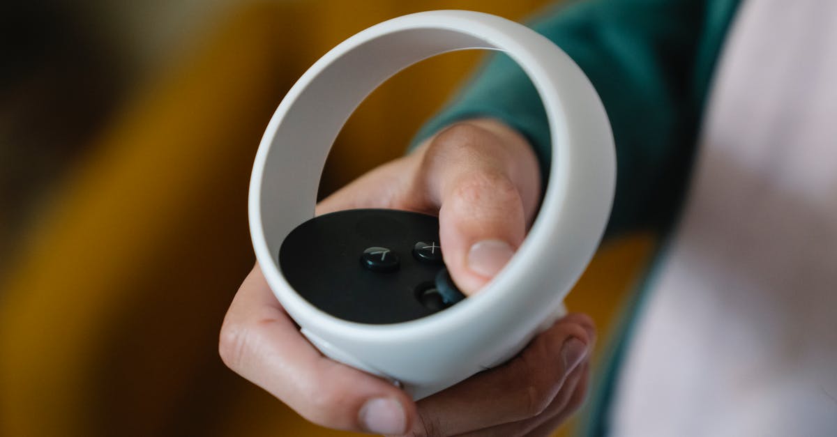 How can I reset a world in Minecraft from a button within the game? - High angle of crop anonymous male gamer using VR controller for playing video game at spare time How can I reset a world in Minecraft from a button within the game? - High angle of crop anonymous male gamer using VR controller for playing video game at spare time