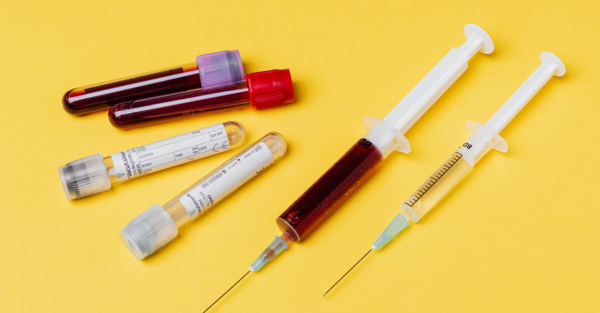 How can I test for a totally empty inventory - From above of medical syringe with medication near injector with blood sample arranged with filled clinical test tubes placed on yellow background