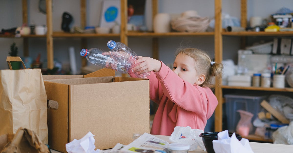 How can I trash unwanted items in Space Engineers? - A Girl Putting Plastic Bottles on a Cardboard Box