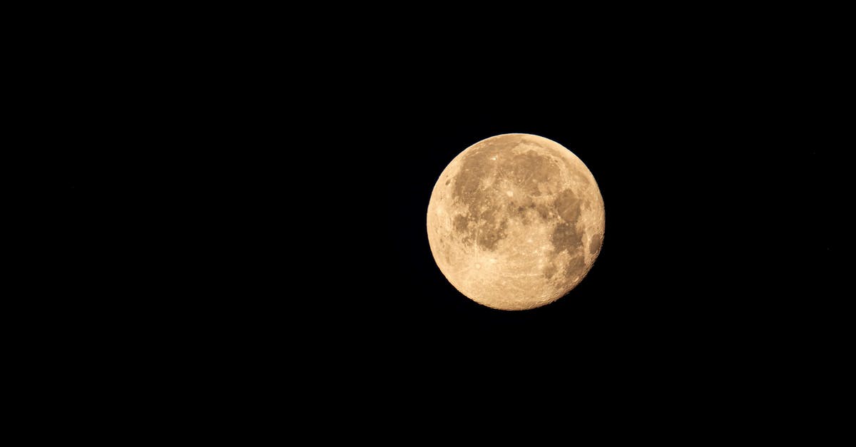 How can I view a full description of god's power? - From below of big bright yellow full moon shining in dark sky at night