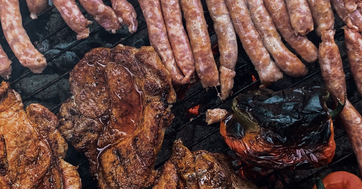 How do extra party members affect fullness when ordering food? - From above yummy steaks and meat sausages roasting on grill grid near organic capsicum during picnic