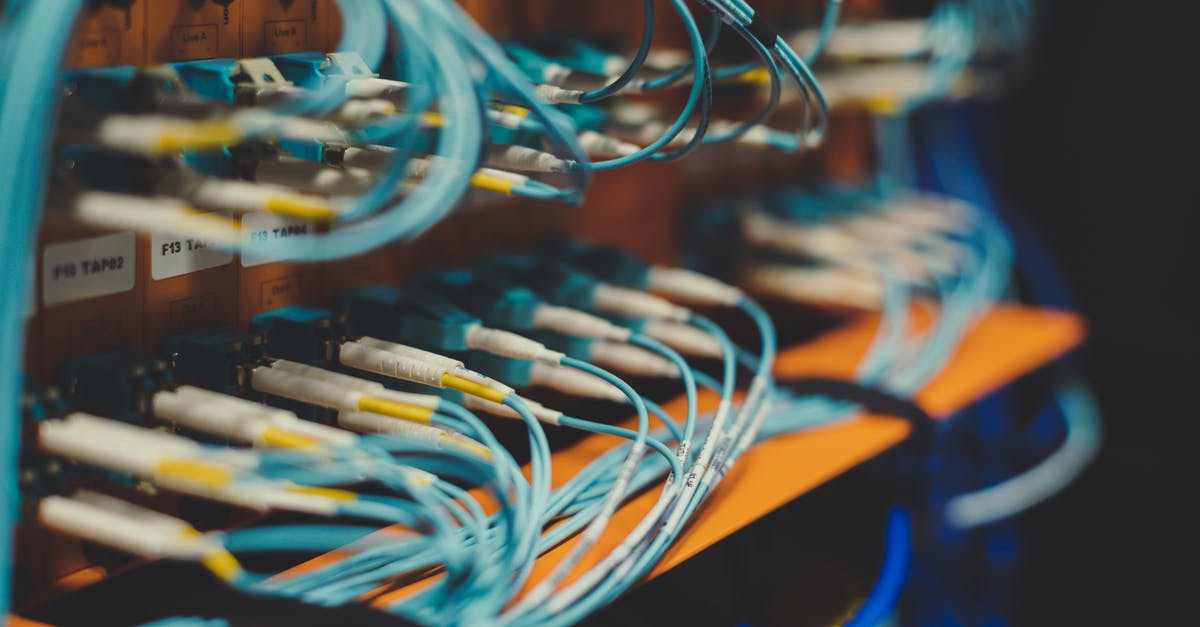 How do I automate power in 2021? - Closeup of many cables with blue wires plugged in modern switch with similar adapters on blurred background in modern studio