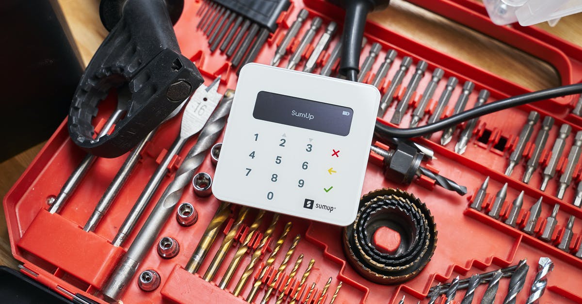 How do I build a device to pull items upwards? [duplicate] - From above of contemporary white cash register on red organizer with metallic instruments