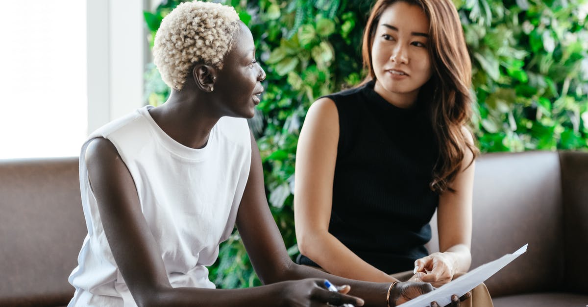 How do I check if my GPU supports Raytracing? - Diverse women talking about job while discussing contract and looking at each other in conference hall