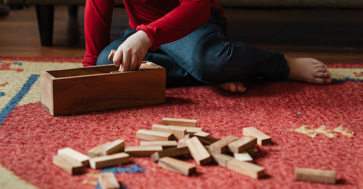 How do I create these seemingly missing building block shapes in 7 Days to Die? - Unrecognizable barefoot kid playing jenga at home