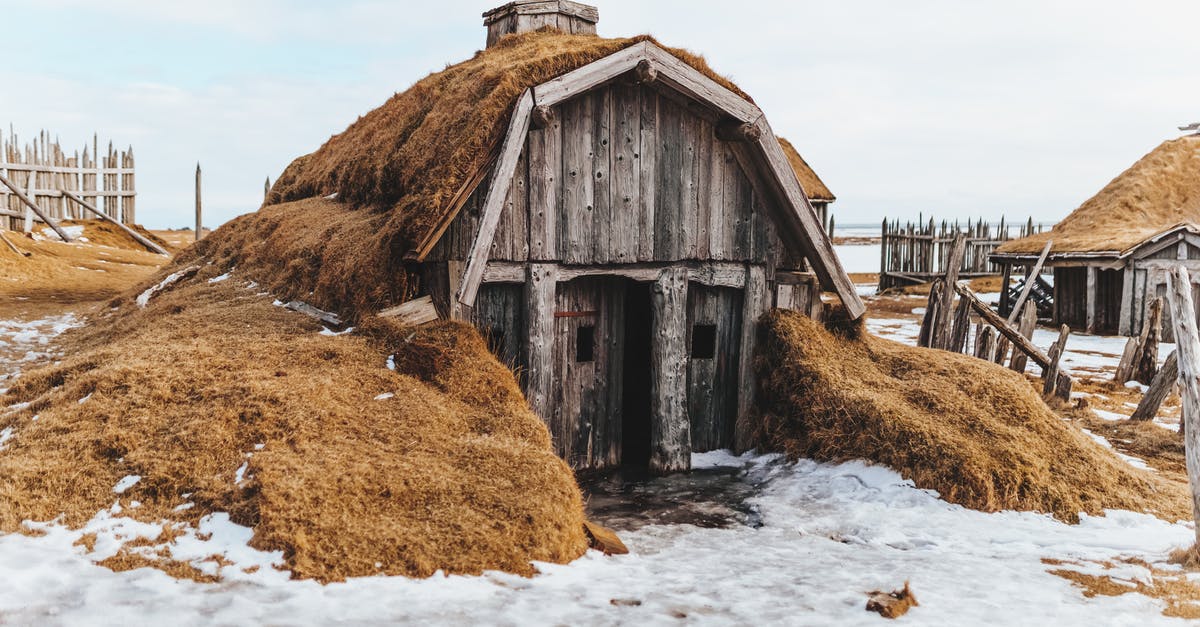 How do I destroy the napalm tank? - Shabby wooden house with grass covered roof in snowy terrain with forgotten village