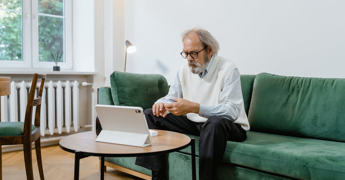 How do I diagnose as a Doctor? - Man in White Dress Shirt and Black Pants Sitting on Green Couch Using Macbook