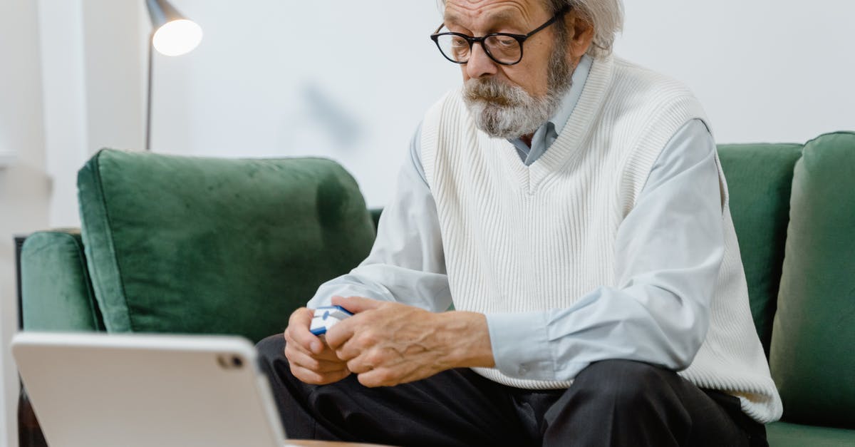 How do I diagnose as a Doctor? - An Elderly Man Sitting in a Couch Holding a Pulse Oximeter