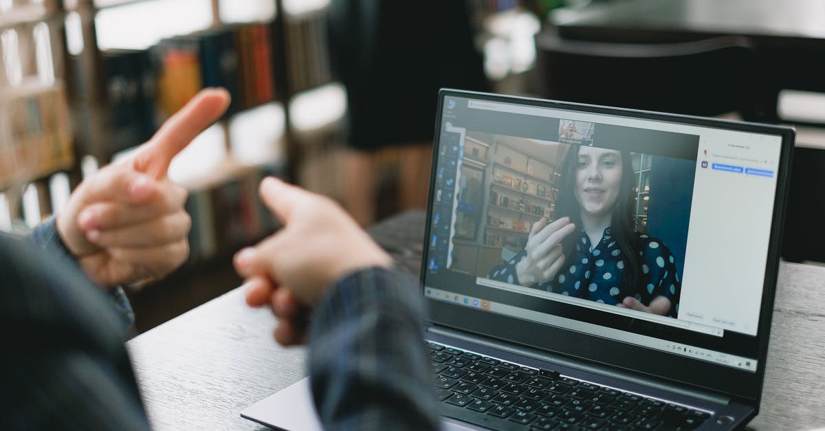 How do I disable chat? - Young lady learning sign language during online lesson with female tutor