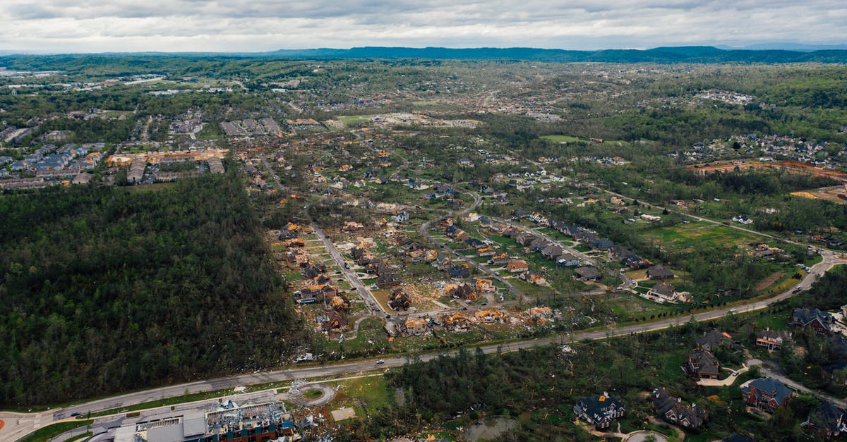 How do I dismantle a power plant? [duplicate] - Aerial view of dramatic consequences of thunderstorm on town suburban district including damaged cottages and uprooted trees