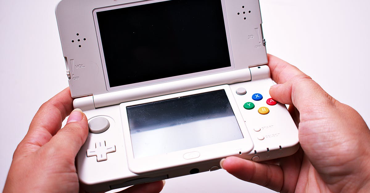 How do I effectively backup my 3DS saved games? - Person Holding Nintendo Ds