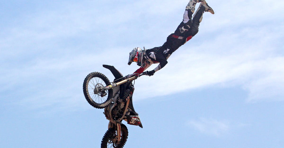 How do I enable cloud sync? - Person Holding Motorcycle Under Blue Sky