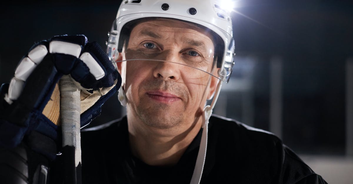 How do I equip gear on PC? (player menu hotkey) - A Close-Up Shot of a Hockey Player Wearing Skullcap