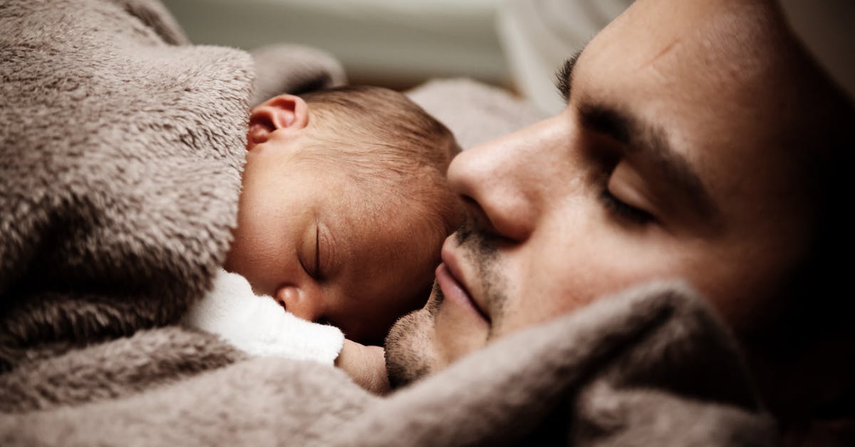 How do I get a good night's sleep? - Sleeping Man and Baby in Close-up Photography