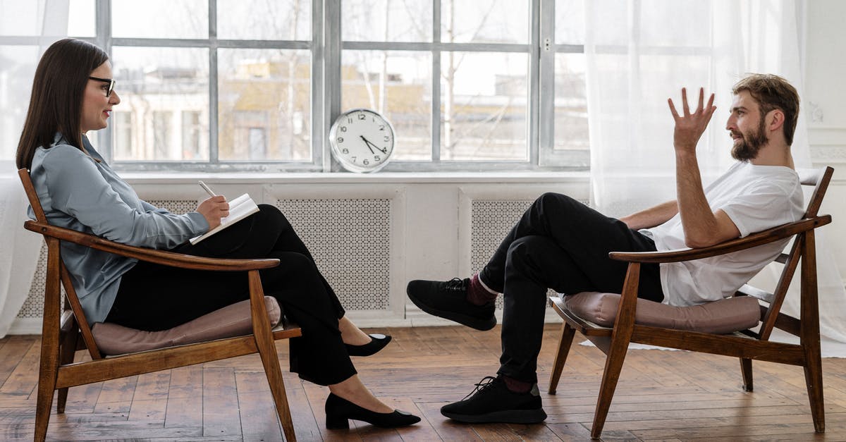 How do I get a Soul of a Hero? - Person in Black Pants and Black Shoes Sitting on Brown Wooden Chair