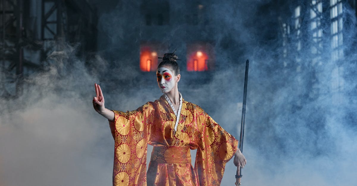 How do I grapple/throw in Mortal Kombat 1? - A Woman in a Kimono Holding a Sword