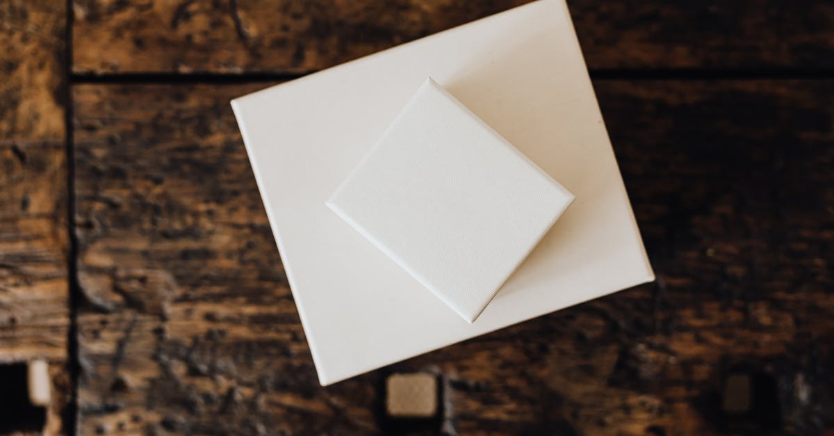 How do I keep my fences from breaking? - Stack of white carton boxes on wooden table