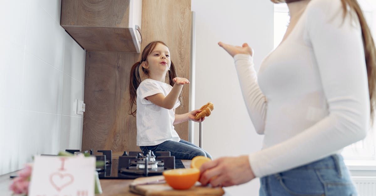 How do I know which fairy food I've collected? - Loving mother and daughter blowing kiss on kitchen