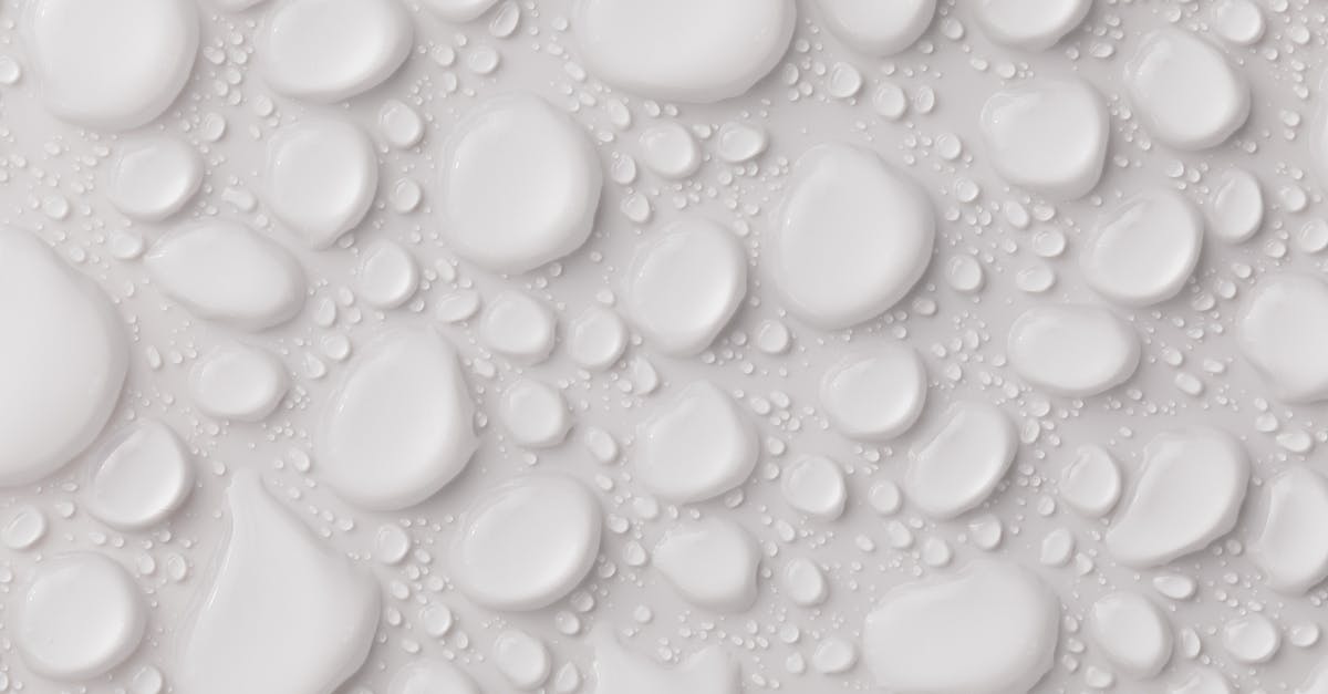 How do I lower the water even more? - Abstract background with white glassy drops