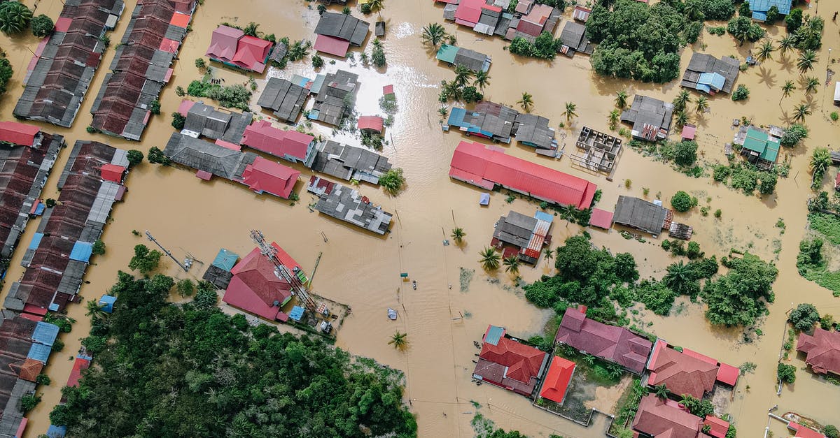 How do I make a city recover from a disastrous flood? - Flooded small village with houses