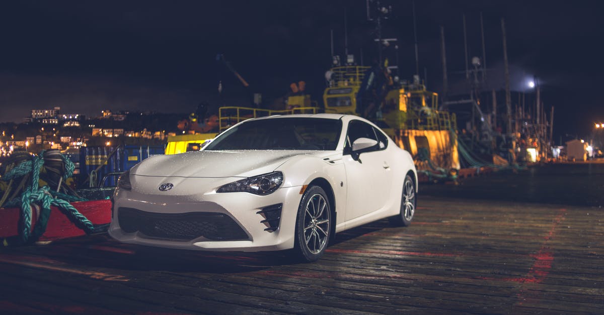 How do I reach the car park platform (Pennsylvania Plaza)? - Contemporary car parked on embankment near port at night