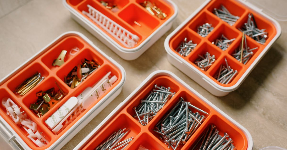 How do I set launcher badges? - From above of boxes with different metal nails and plastic dowels in workshop