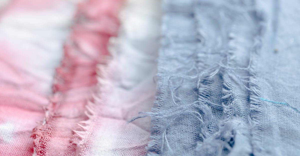 How do I split stacked materials in equal stacks on the crafting table? - Blue and pink textile with threads placed on surface in modern professional studio on blurred background during production of clothes How do I split stacked materials in equal stacks on the crafting table? - Blue and pink textile with threads placed on surface in modern professional studio on blurred background during production of clothes