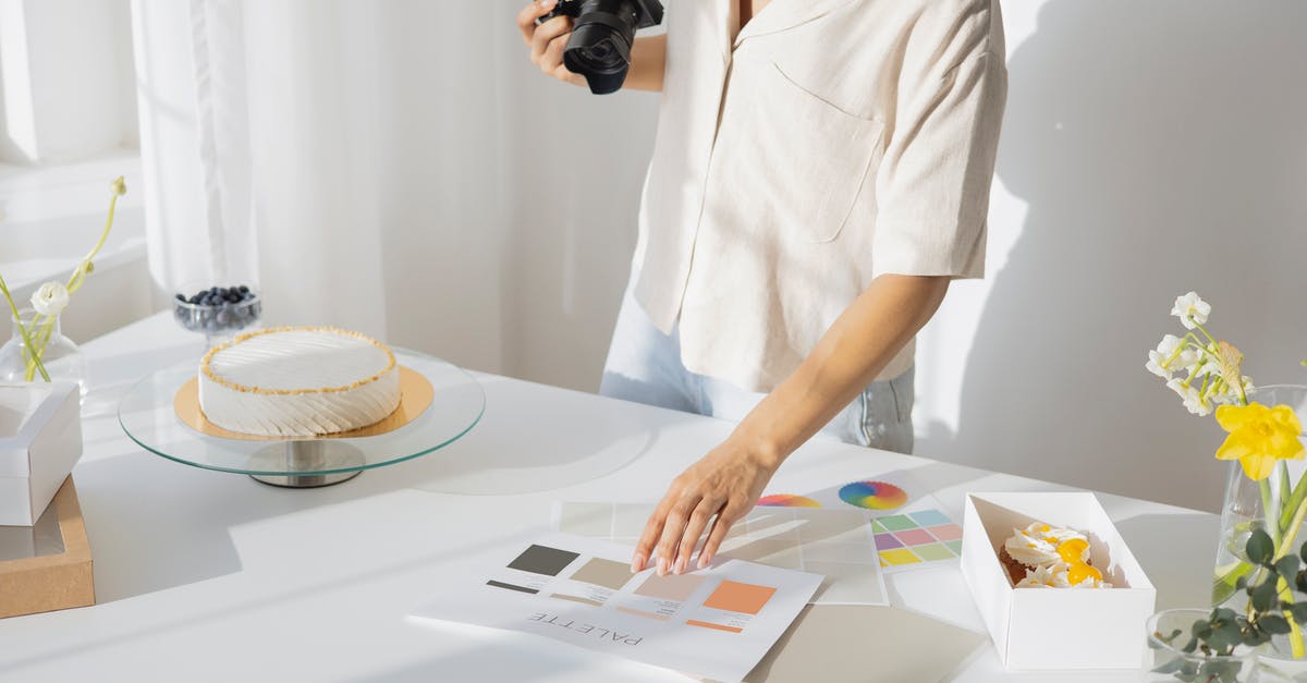 How do I take my badges out and look at them? - Person Holding Camera and Color Pallet