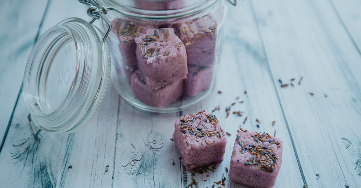 How do I take the bomb flower to Dodongo's Cave? - Aromatic purple bath bombs in glass jar arranged on white table