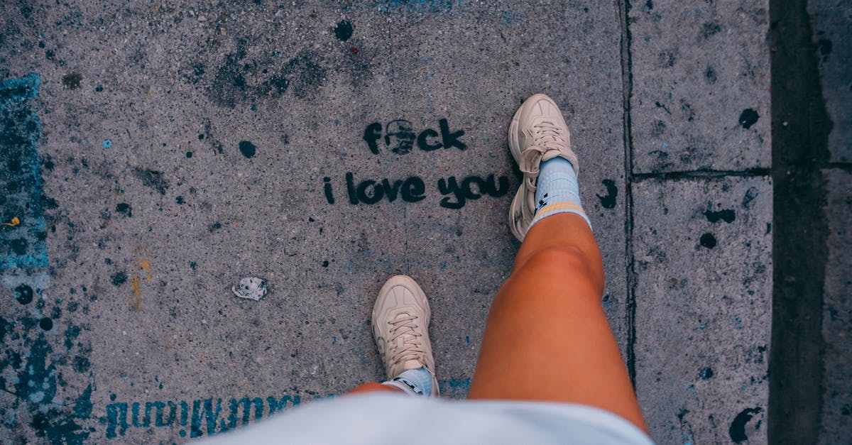 How do i undo ignoring an error? - Person in White Shorts and White Sneakers Standing on Gray Concrete Pavement