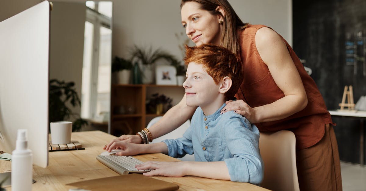 How do I use game tickets? - Photo of Woman Teaching His Son While Smiling