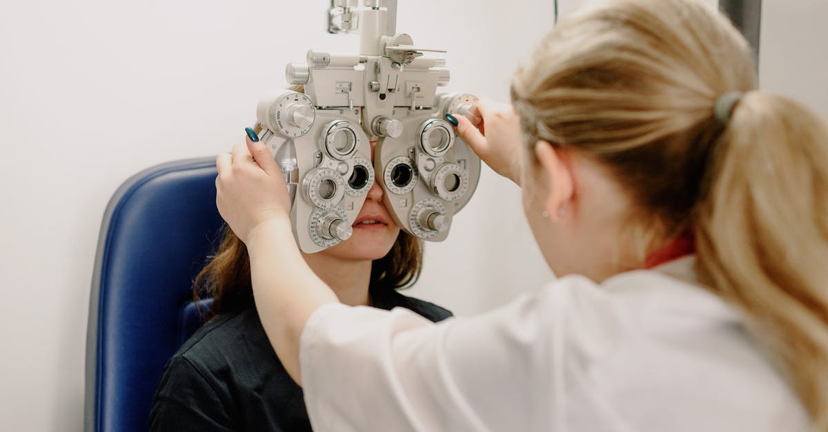 How do Measure weapons work? - Unrecognizable ophthalmologist checking vision of patient