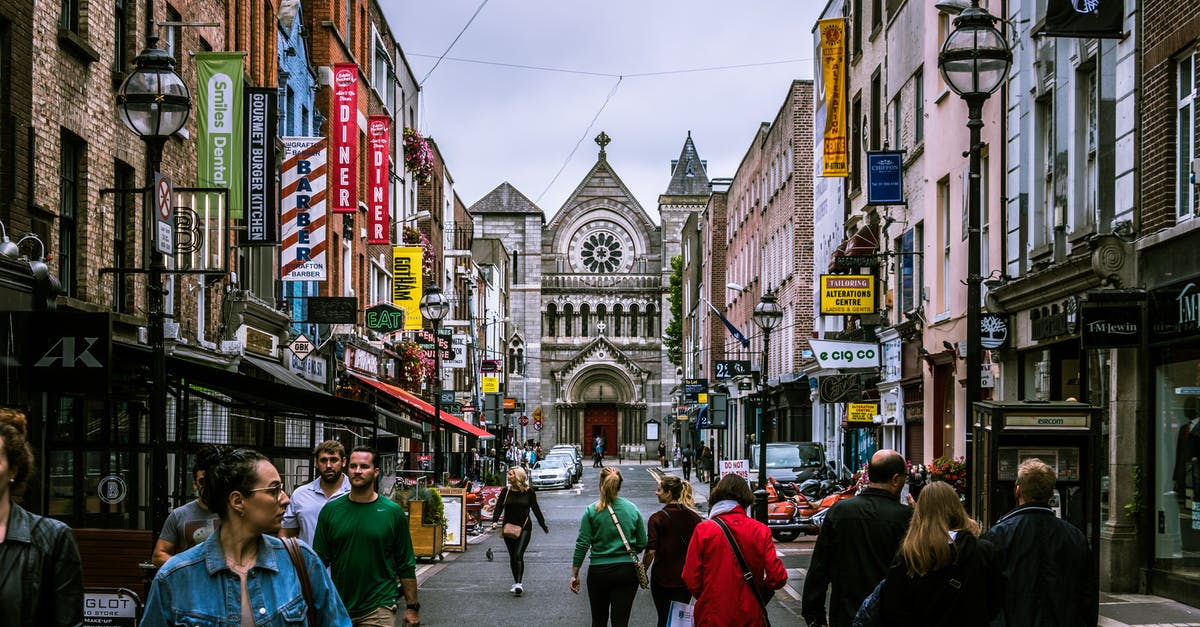 How do travelers work? - Photo of People Walking on Street