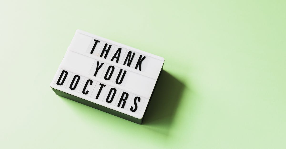 How do you change control schemes? - From above of vintage light box with THANK YOU DOCTORS inscription placed on green surface