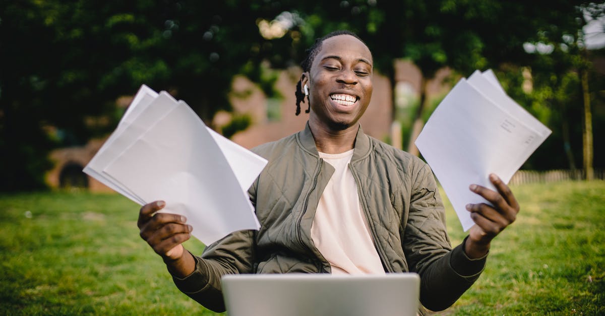 How do you complete last stand: roof? - Student with documents and laptop happy about getting into university