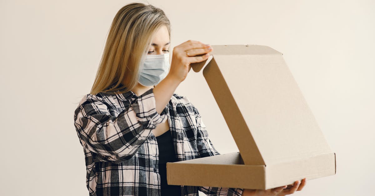 How do you open the gold sliding mask puzzle box? - Young woman in medical mask opening pizza box