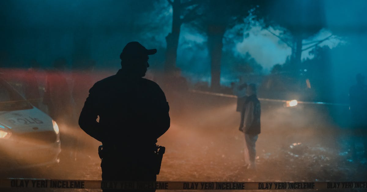 How do you reach this obscure Chrono Trigger scene? - Silhouette of policeman and investigators standing behind crime scene boundary tape at night in forest