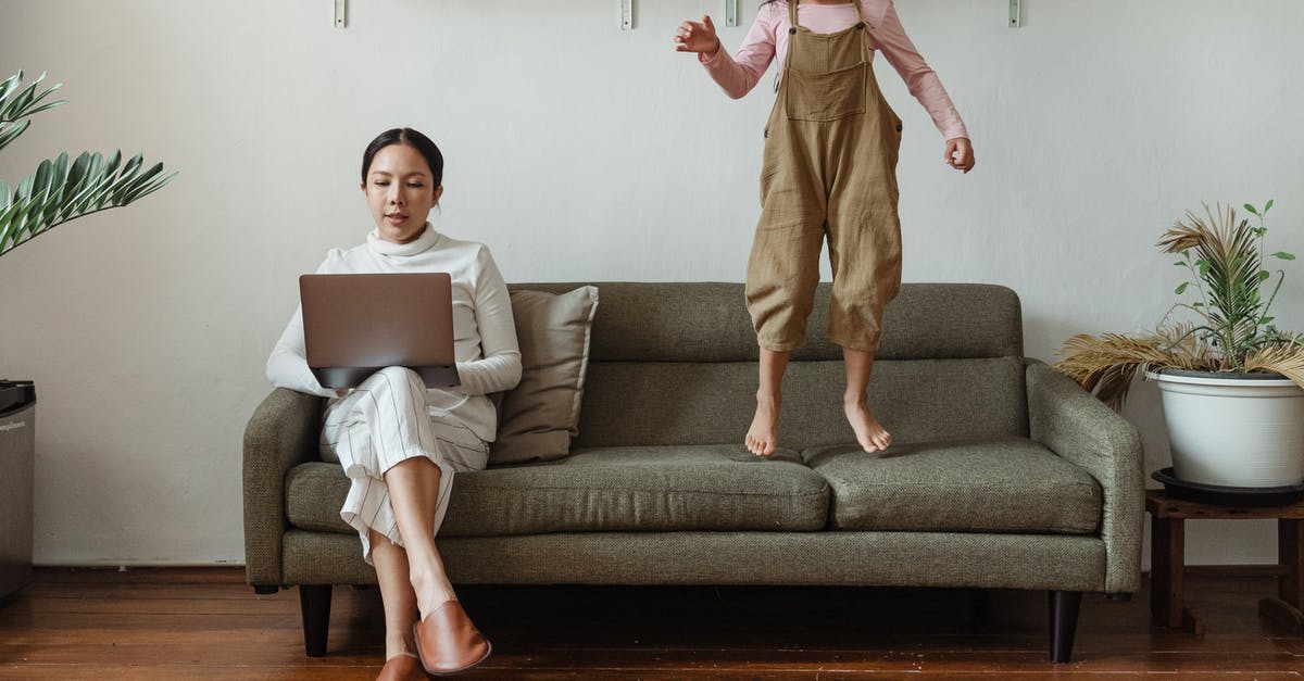 How does Crouch jump actually work? - Focused mother working on laptop near disturbing daughter