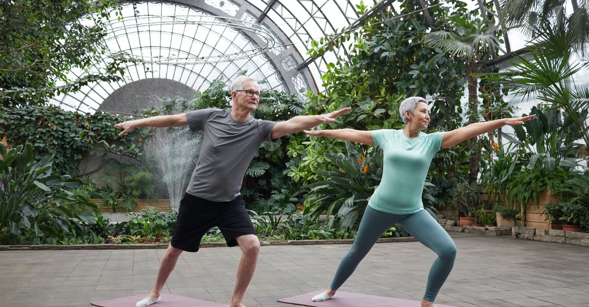 How does difficulty level affect my exercise? - Couple Practicing Yoga