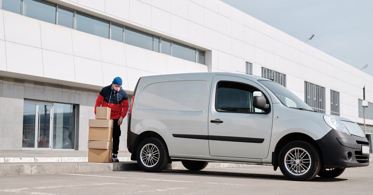 How does dual wielding work in Diablo 2? - Delivery Man With Boxes next to a White Van