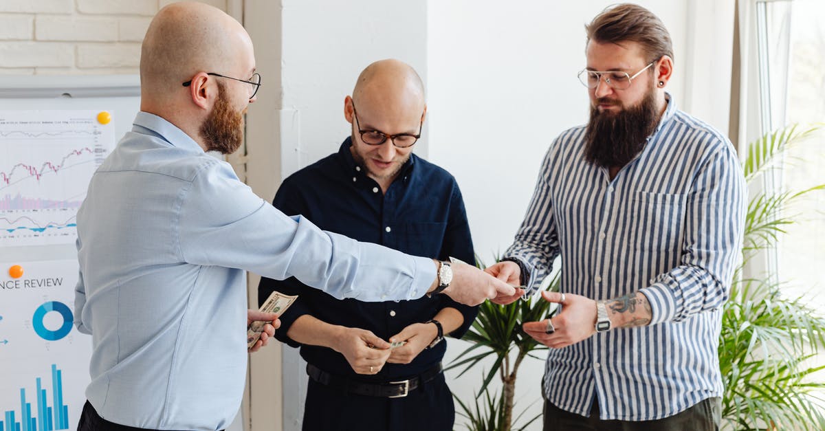 How does MMR work? - Man in Blue Dress Shirt Standing Beside Man in White and Black Striped Dress Shirt