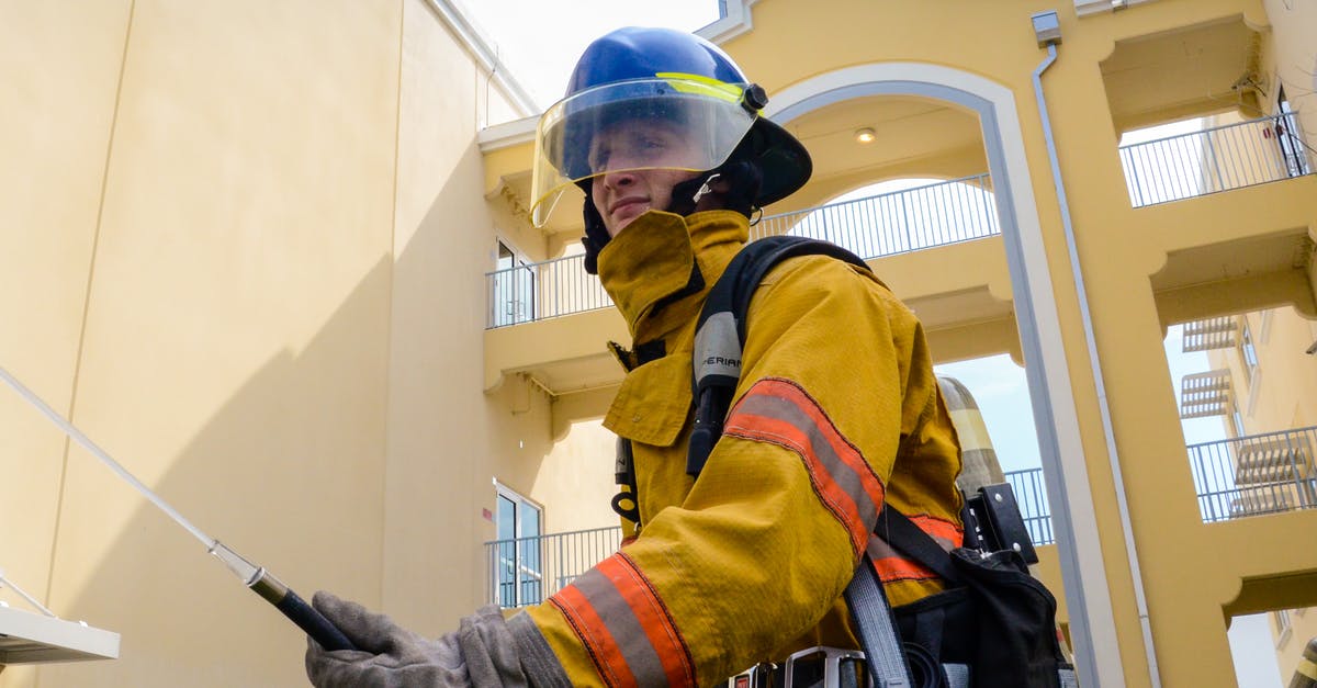 How does rescuing work? - Photo of Firefighter Beside Building