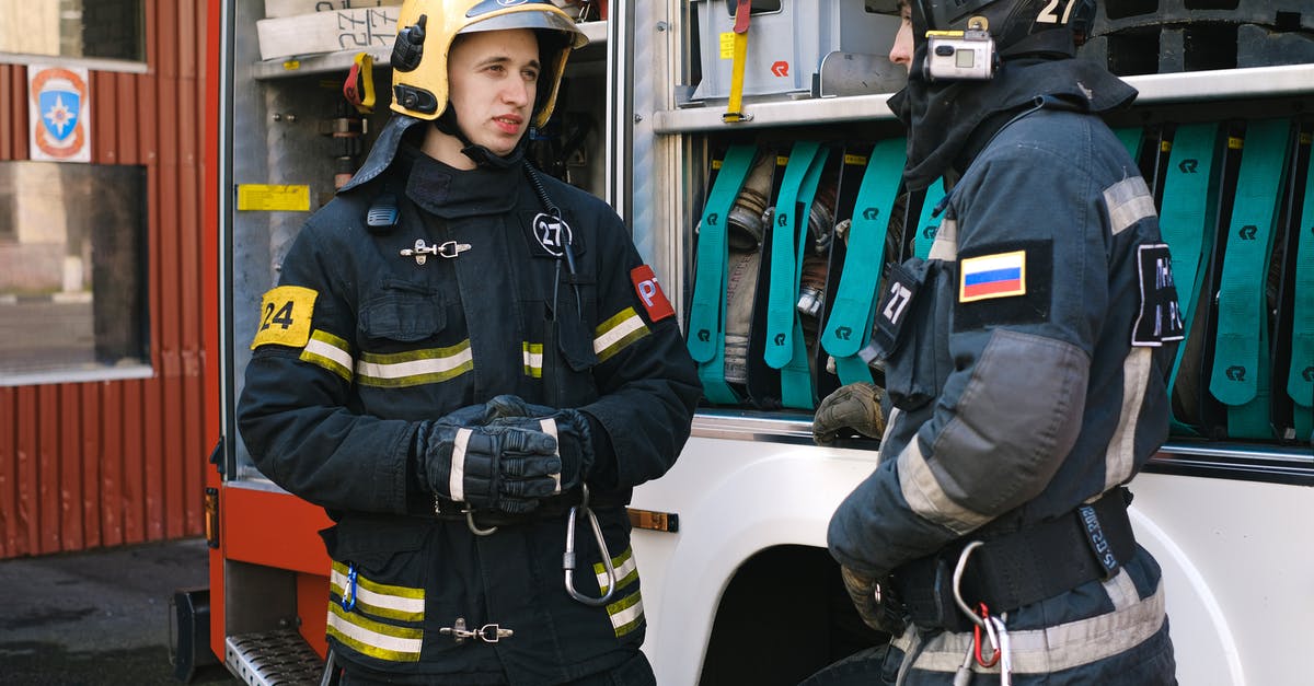 How does rescuing work? - Firefighters Having a Conversation while Standing