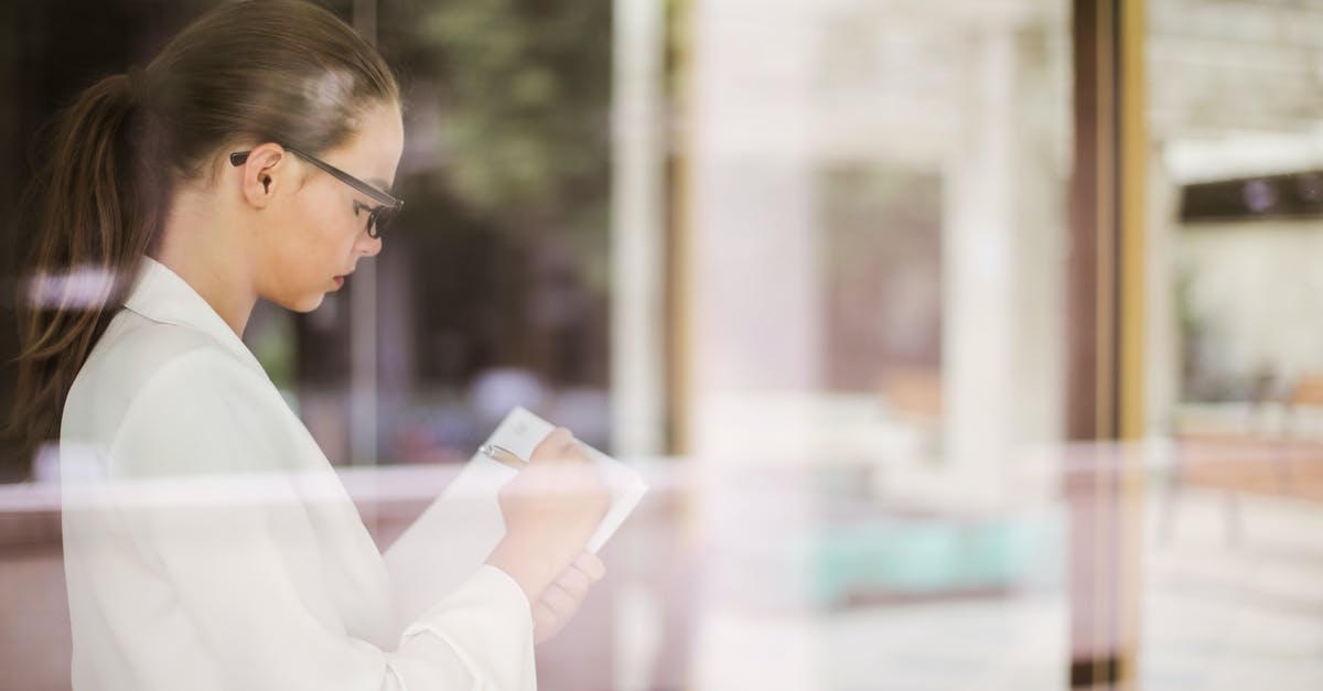 How does the auto-buy determine which items/abilities to buy? - Side view of young concentrated businesswoman in formal clothing standing in office and writing ideas about startup project