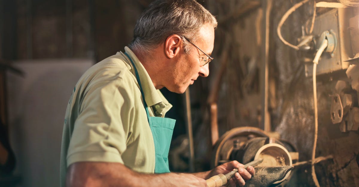 How does the Electro Dragon's lightning chain work? - Senior male turner working on lathe machine in workshop