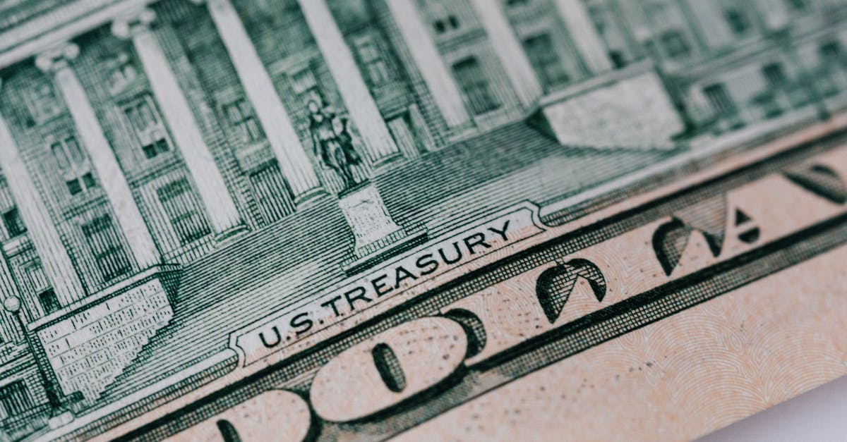 How does Treasury in Heroes IV work? - Dollar banknote on white table