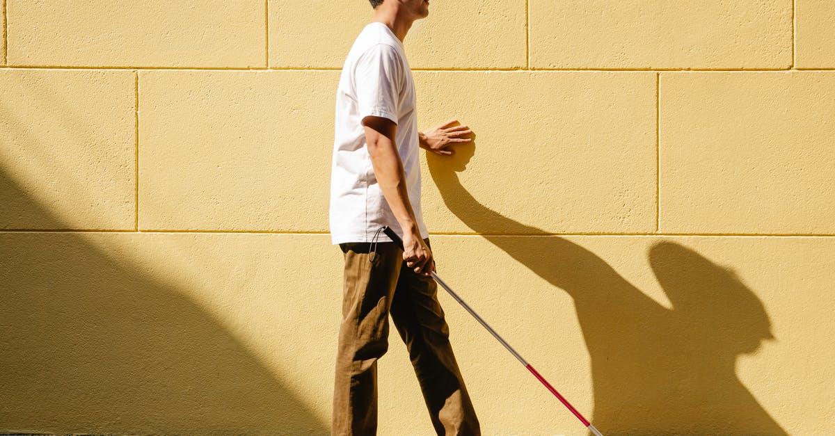 How does Yennifer feel about Geralt's promiscuity? - Photo of Man Walking on the Wall Side Using Cane 